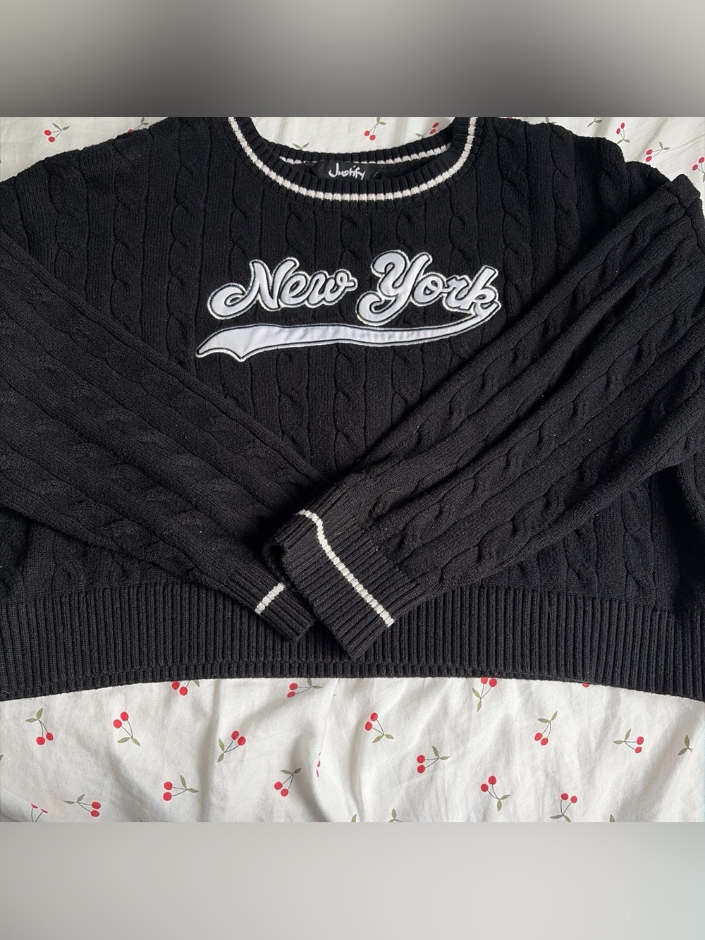 Justify Black Cable-Knit Crewneck Sweater with White Trim